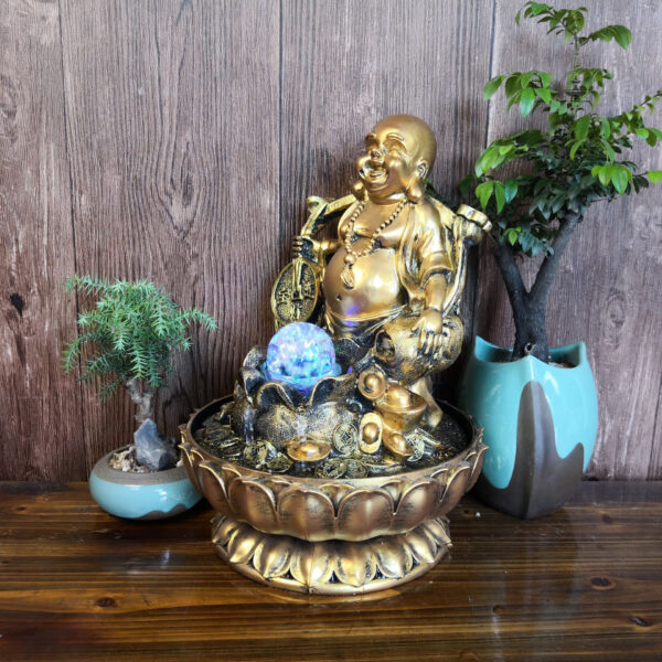 Fontaine apaisante avec statue de Bouddha joyeux