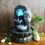 Décoration zen avec fontaine visage Bouddha élégante